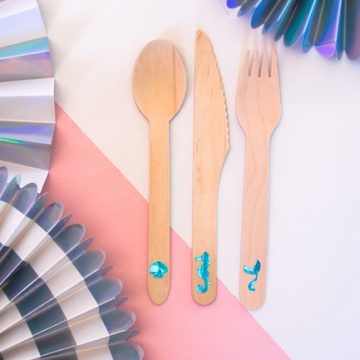 Create personalized wood cutlery using your Cricut and some vinyl. This mermaid cutlery is perfect for your next mermaid party. #mermaid #cricut #craftlightning #cricut #cricutmade #mermaidparty
