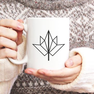 woman holding fall mug