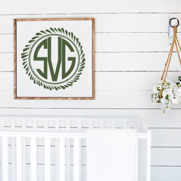 monogram above a white crib